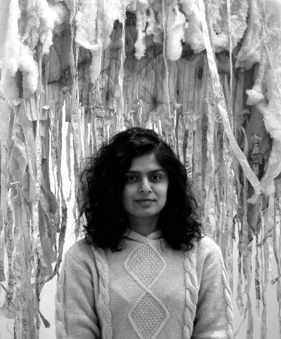 Press portrait of Priya Dave, photographed in front of the Whisper Chamber.